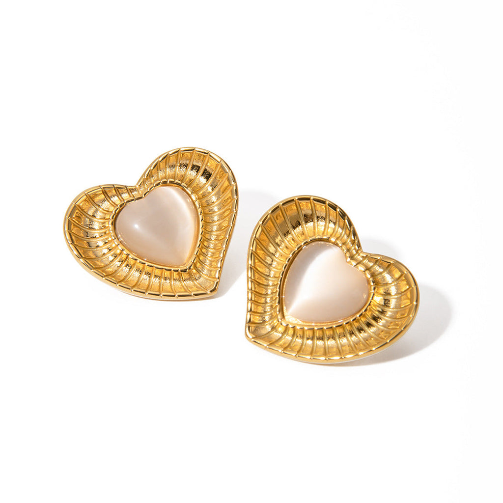 White cat eye stone earrings with niche temperament titanium steel earrings