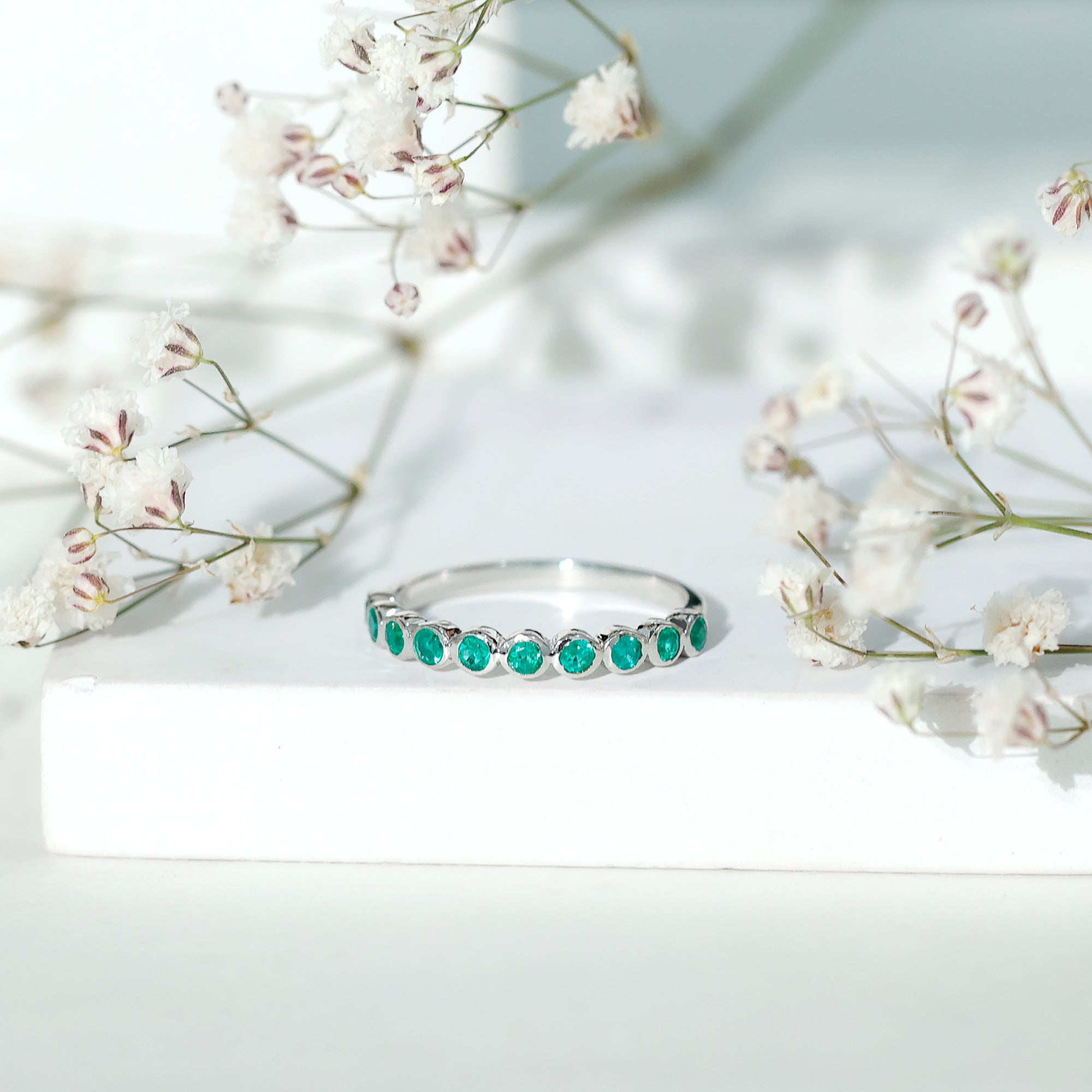 Natural Emerald Half Eternity Ring in Bezel Set