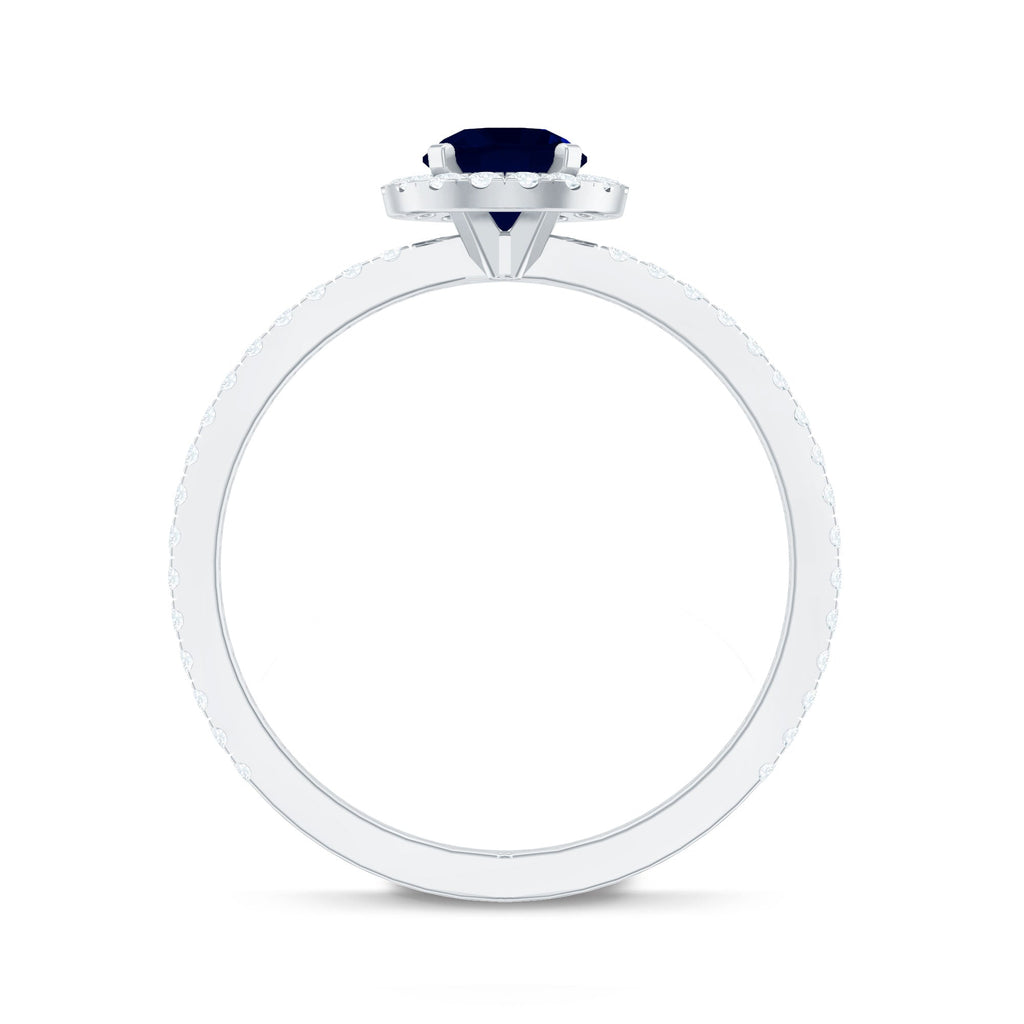 0.95 Carat Round Blue Sapphire and Diamond Halo Engagement Ring